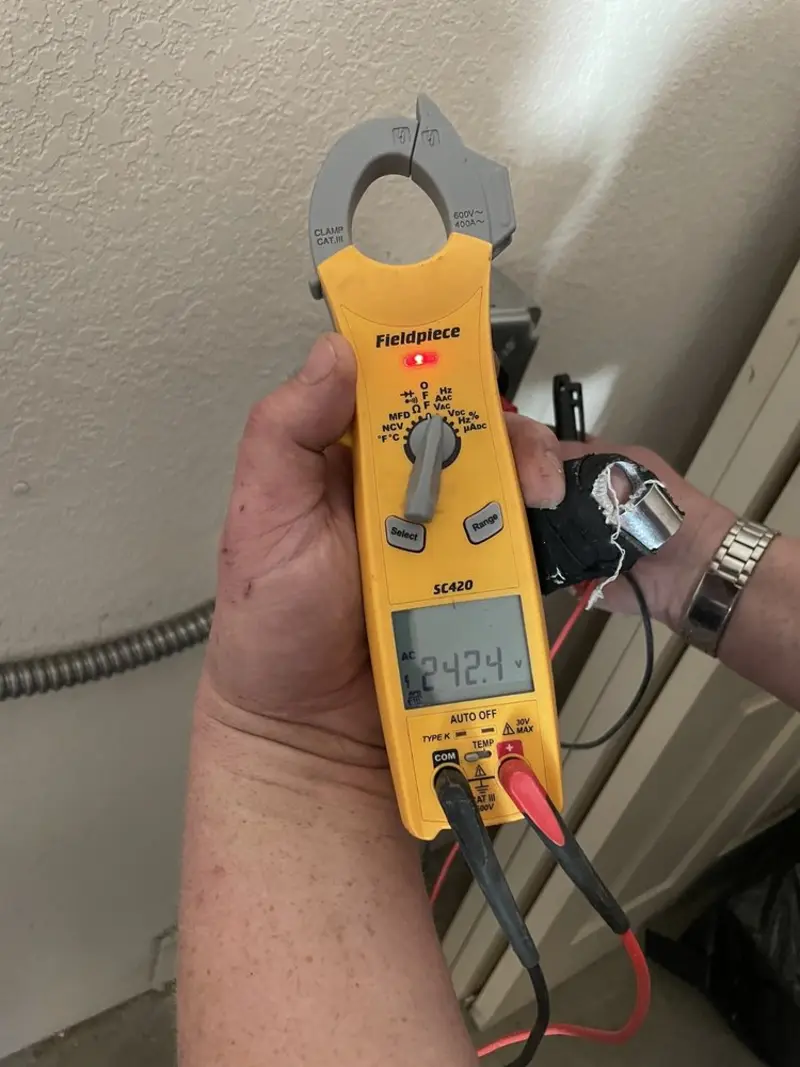 Voltage testing with clamp meter during Outlet Installation in Palos Park